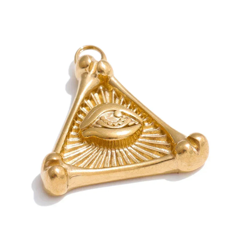 Gold triangular pendant with eye design on a white background
