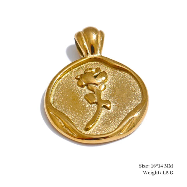 Gold pendant with floral design on a white background