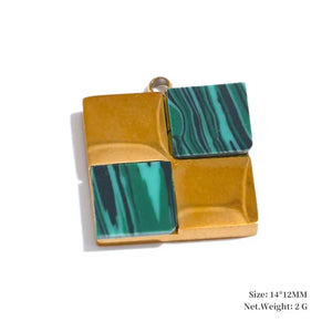 Gold and green square pendant on a white background