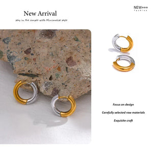 Gold and silver hoop earrings on a textured stone surface with promotional text.