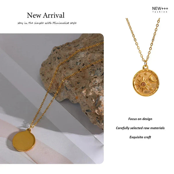 Gold necklaces with circular pendants on a neutral background