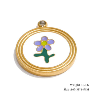 Gold pendant with a colorful flower design on a white background