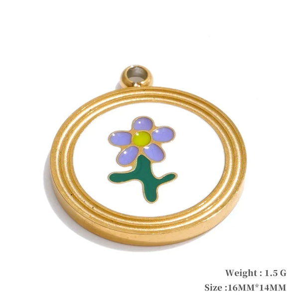 Gold pendant with a colorful flower design on a white background