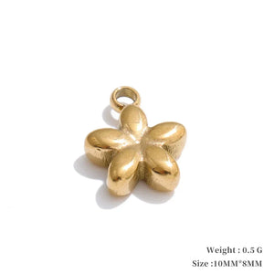 Gold flower-shaped pendant on a white background