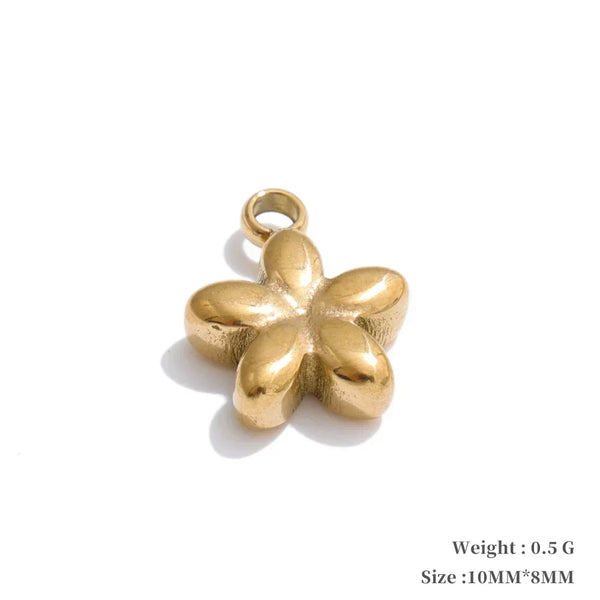 Gold flower-shaped pendant on a white background