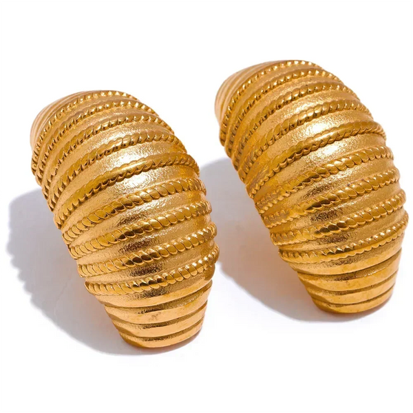 Pair of gold spiral earrings on a white background