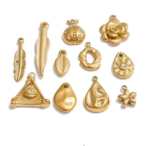 Collection of gold jewelry pendants on a white background with 'Yipup' branding.