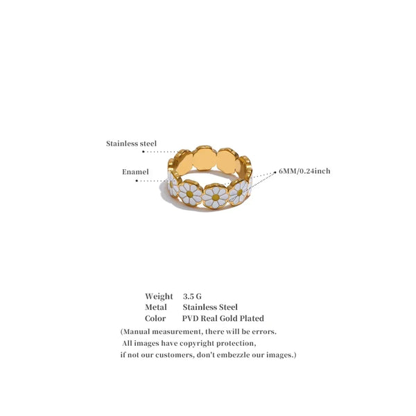 Gold ring with daisy design on a white background