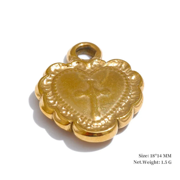 Gold heart-shaped pendant with cross design on a white background