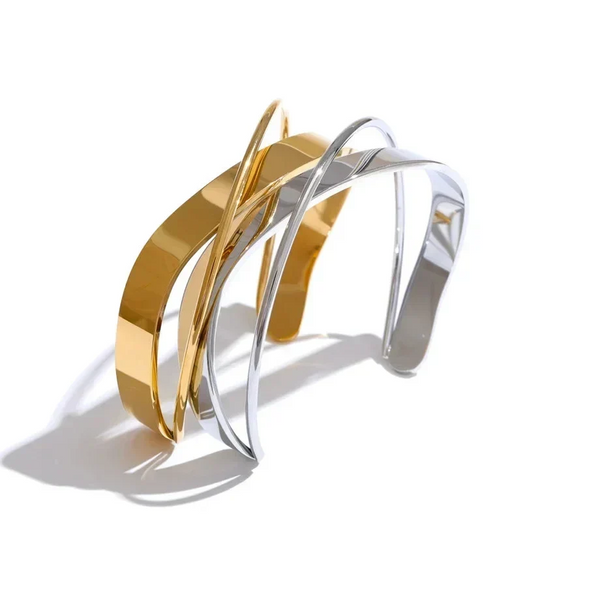 Gold and silver bracelet on a white background.