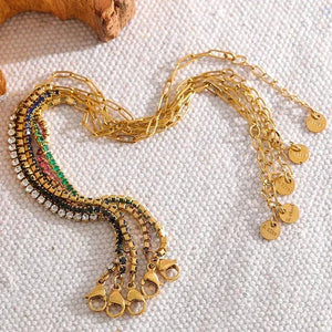 Gold-plated adjustable bracelets with sparkling colored crystals on textured fabric