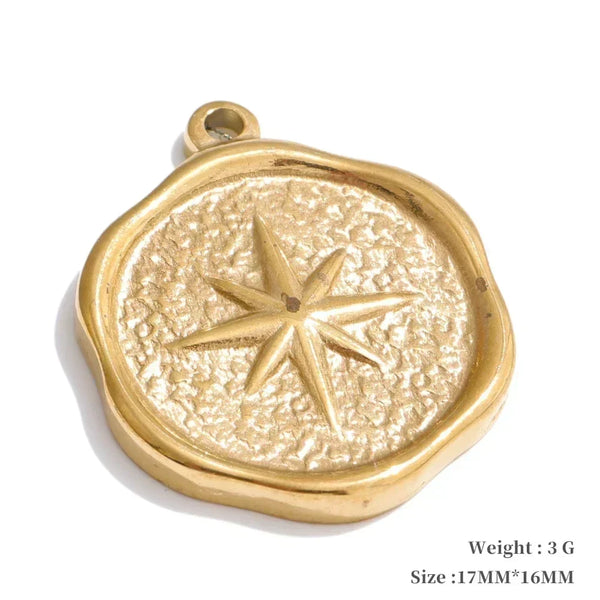 Gold pendant with star design on a white background