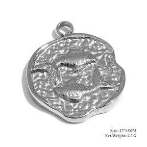 Silver pendant with dolphin design on a white background