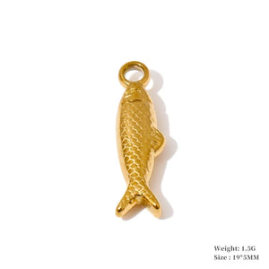 A gold-colored fish-shaped jewelry charm with a textured scale pattern and a top loop, shown on a white background with product specifications printed in the bottom right corner.