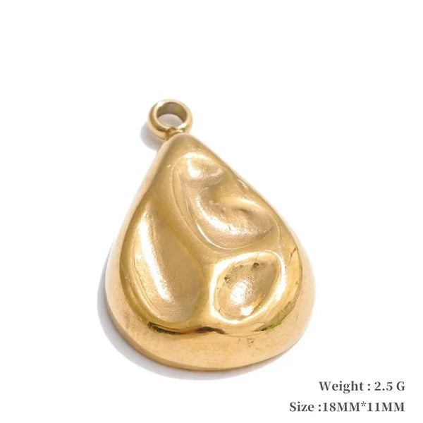 Gold teardrop-shaped pendant on a white background