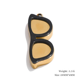 Gold and black cat-eye pendant on a white background