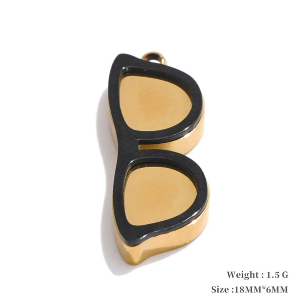 Gold and black cat-eye pendant on a white background