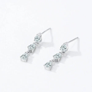 A pair of silver-toned drop earrings with three marquise-cut clear stones in each earring, displayed on a clean white background with 'Product Display' text at the top.