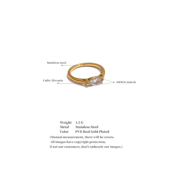 Gold ring with cubic zirconia stone on a white background