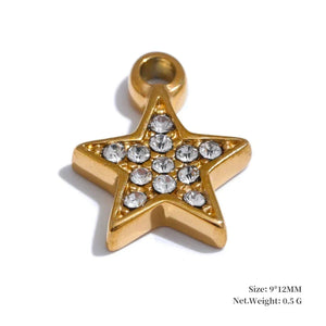 Gold star-shaped pendant with embedded crystals on a white background