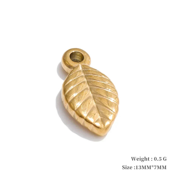 Gold leaf-shaped pendant on a white background