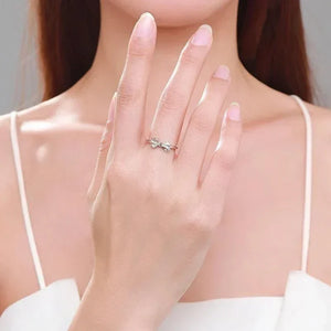 Woman wearing a delicate 925 silver knot ring, minimalist jewelry on hand