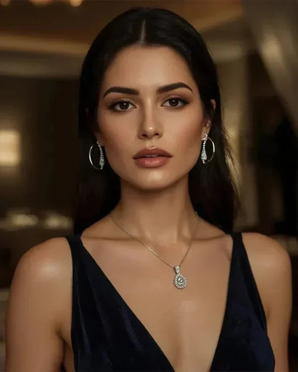 Timeless sterling silver jewelry set featuring elegant drop earrings and a minimalist necklace.