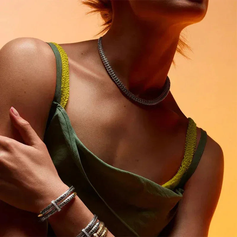 Close-up of premium 925 Sterling Silver and 18K Gold Plated jewelry on a model